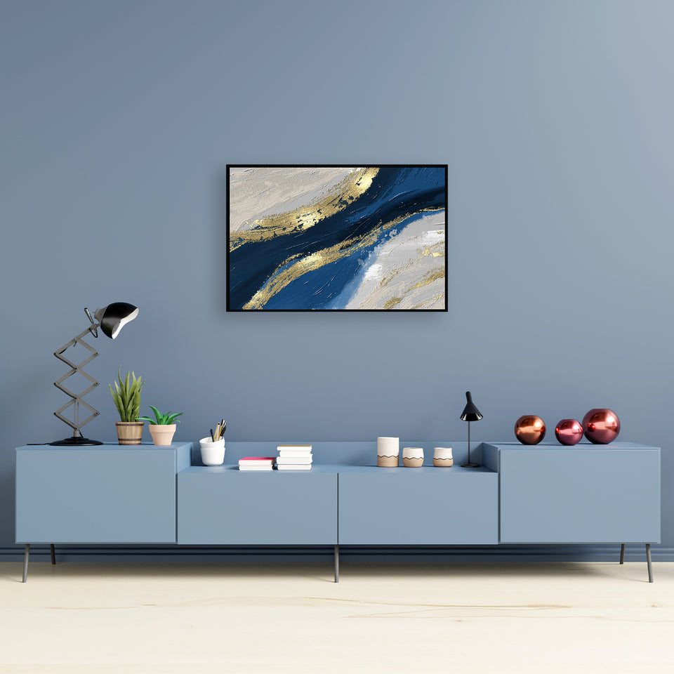 Abstract ocean waves in gold and blue crash against the shore canvas painting.