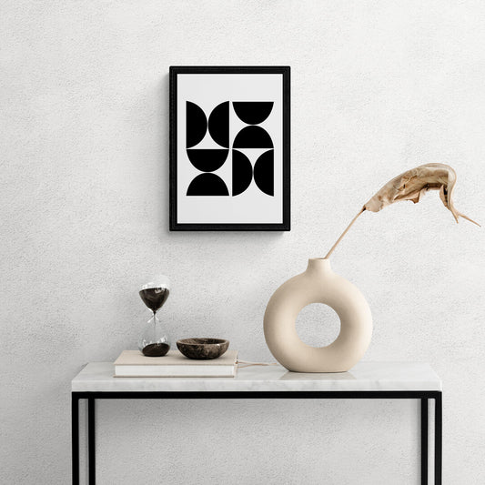 Canvas art of bold shapes find harmony in negative space.